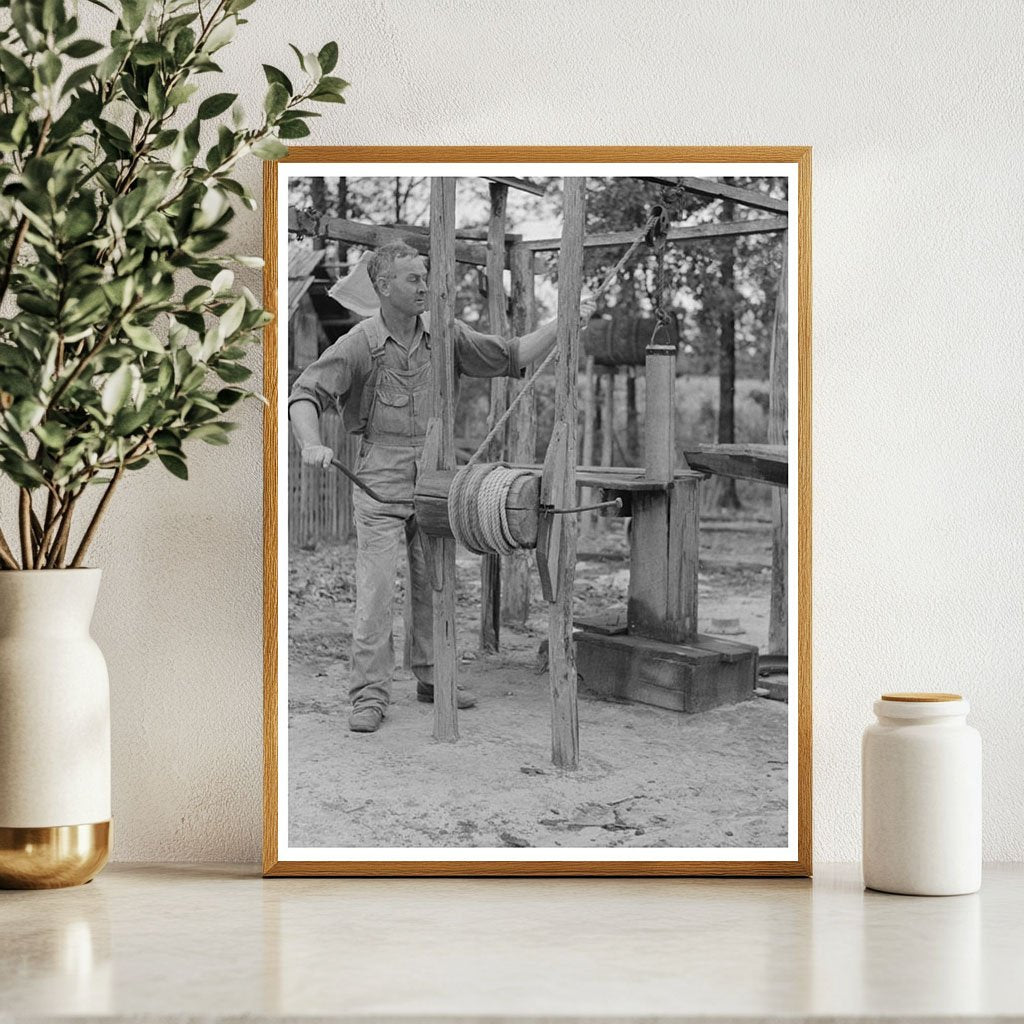 Cut-Over Farmer Drawing Water in Amite Louisiana 1938