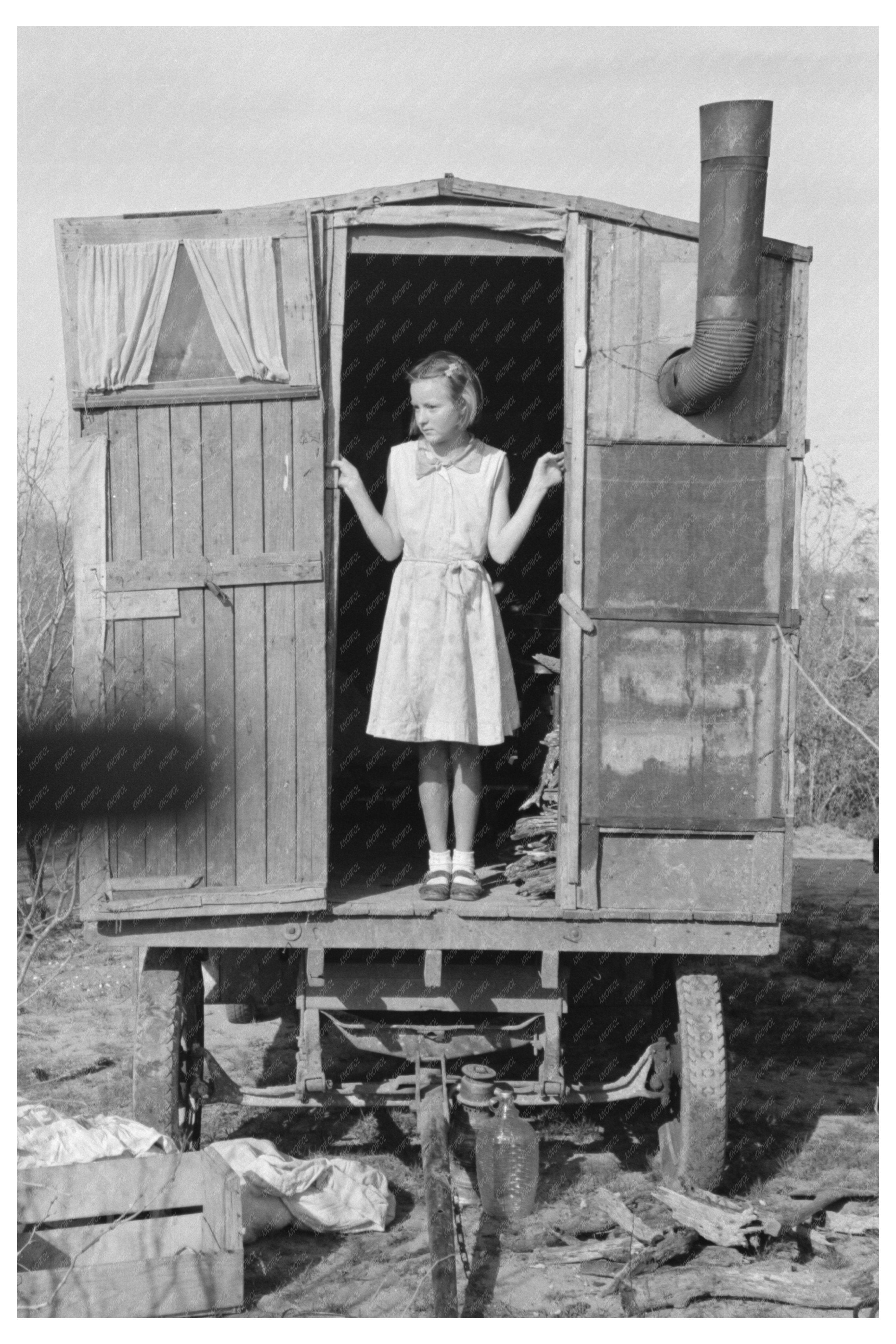 Migrant Girl in Doorway of Trailer Texas 1939