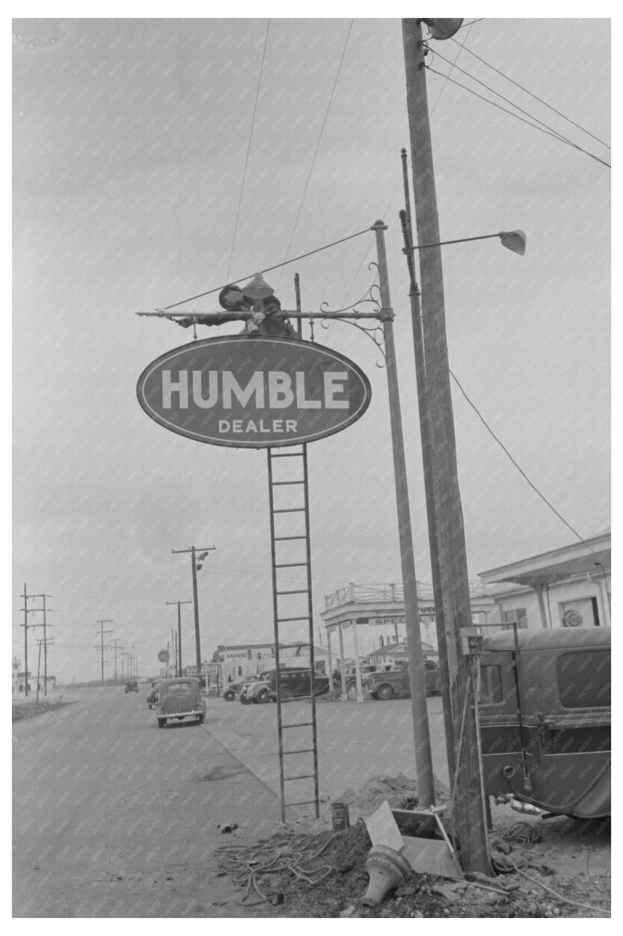 Man Erects Sign in Alice Texas March 1939