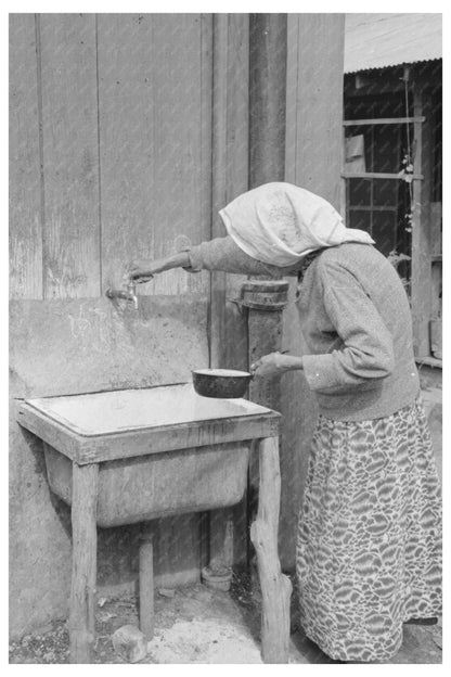 Elderly Woman Drawing Water in San Antonio 1939