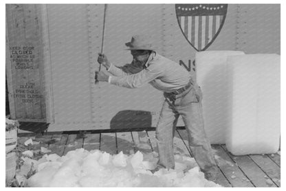 Worker Breaking Ice in La Pryor Texas March 1939