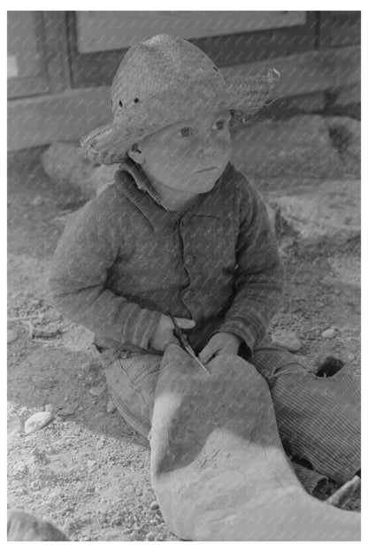 Boy Cutting Inner Tube in El Indio Texas March 1939