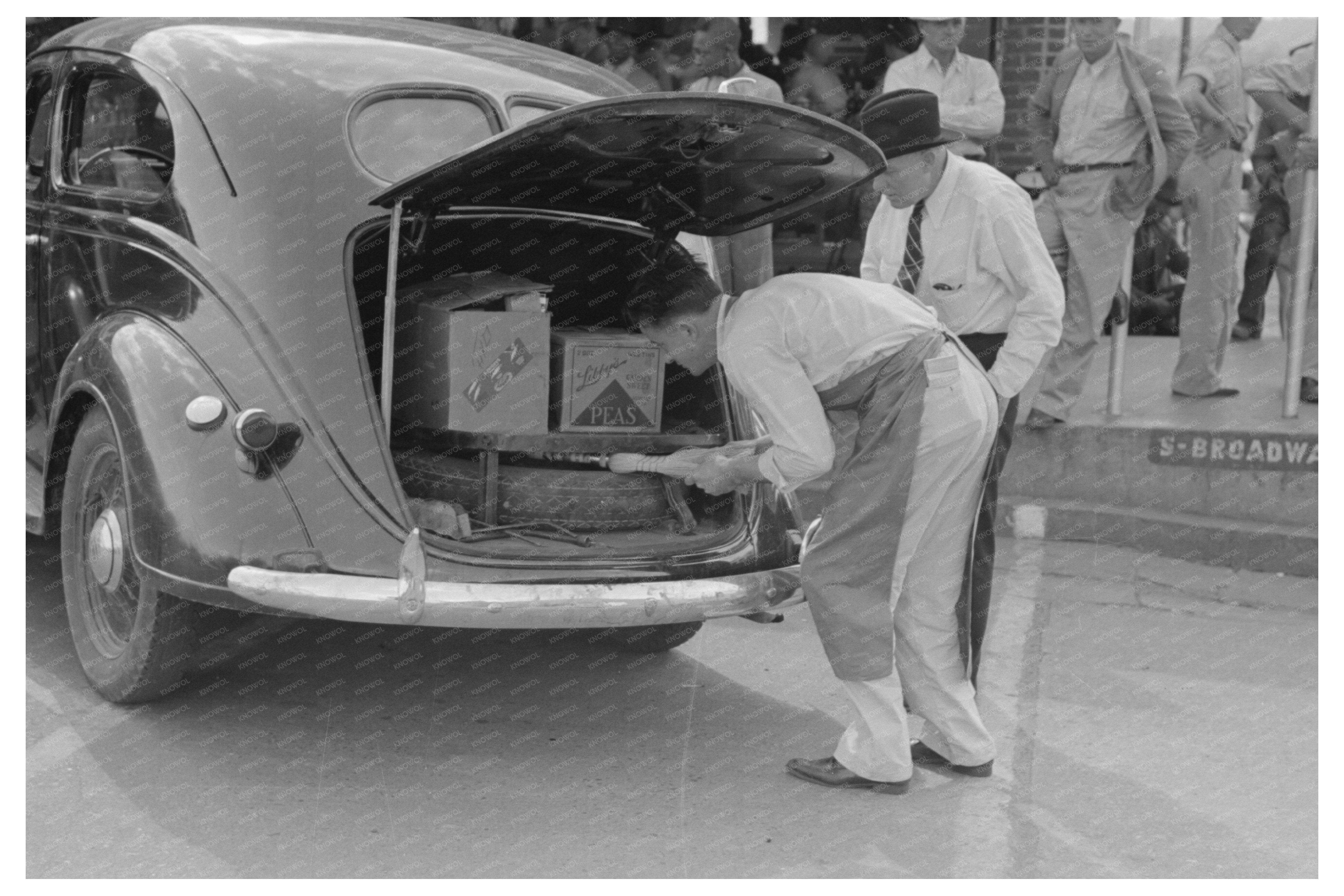 Grocery Clerk Loads Supplies in San Augustine Texas 1939