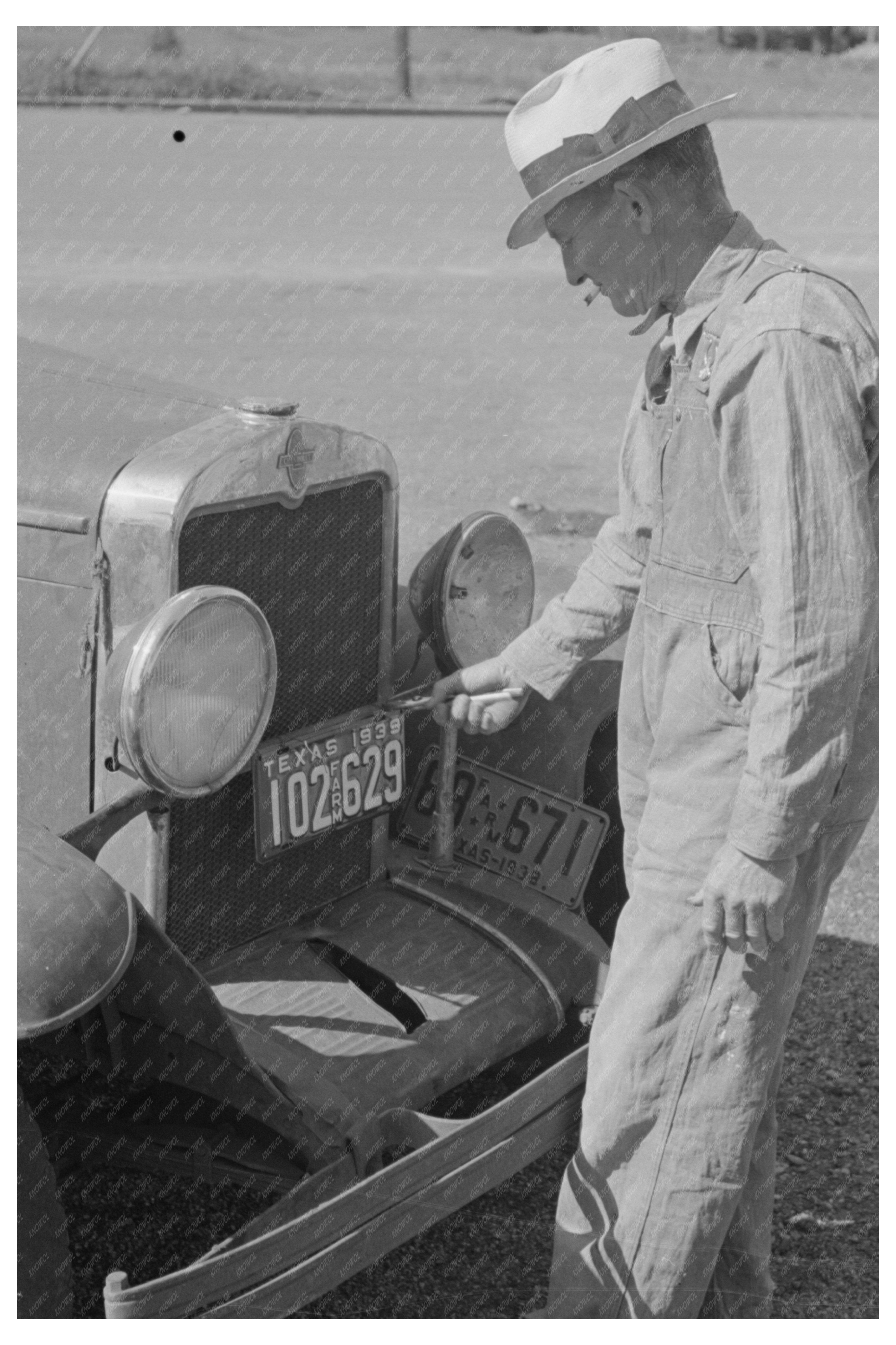 Farmer Changing License Plates San Augustine Texas 1939