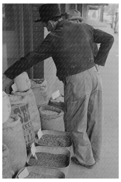 Farmer Inspects Seed for Sale San Augustine Texas 1939