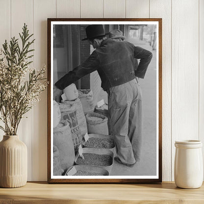 Farmer Inspects Seed for Sale San Augustine Texas 1939