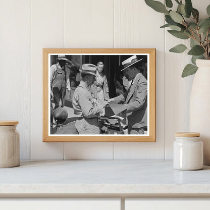 Salesman Shows Suit Material to Farmer in Hammond 1939