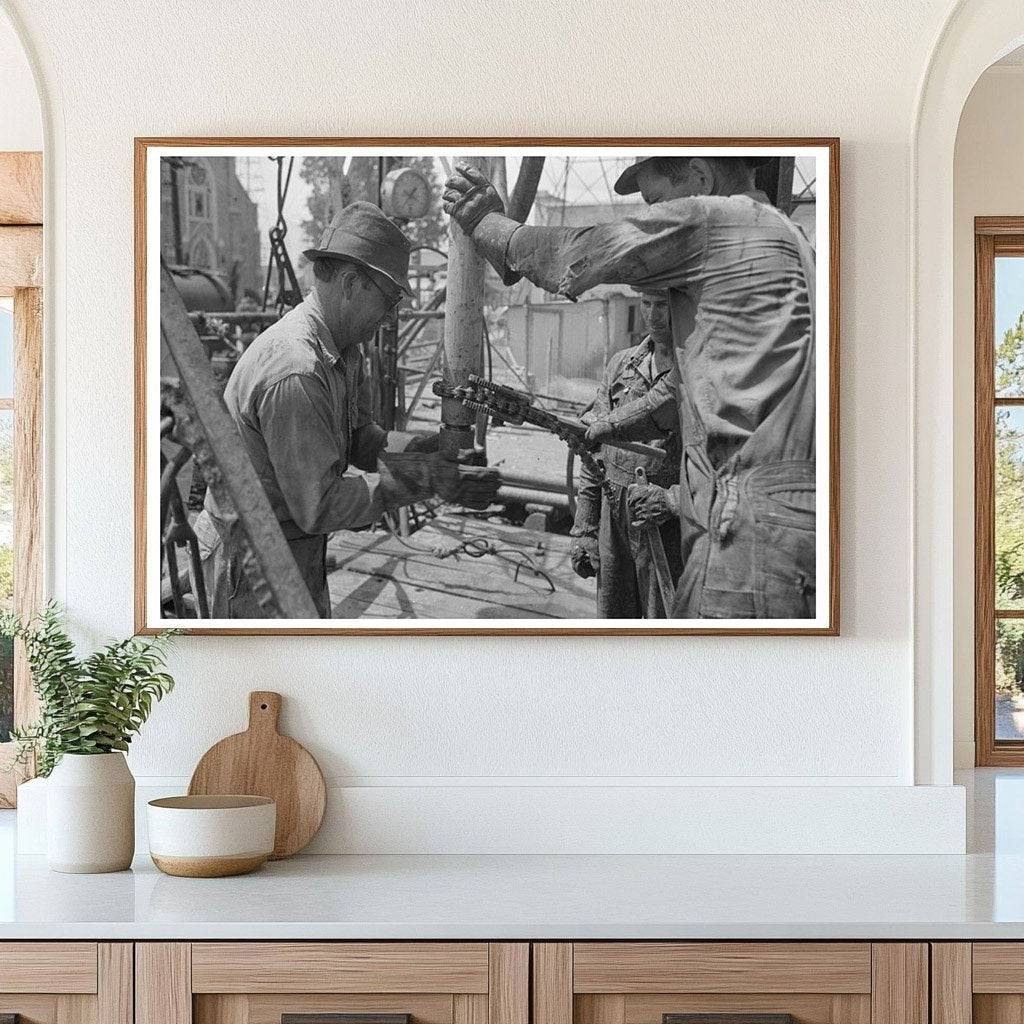 Oil Field Worker Attaching Nipple to Drill Stem 1939