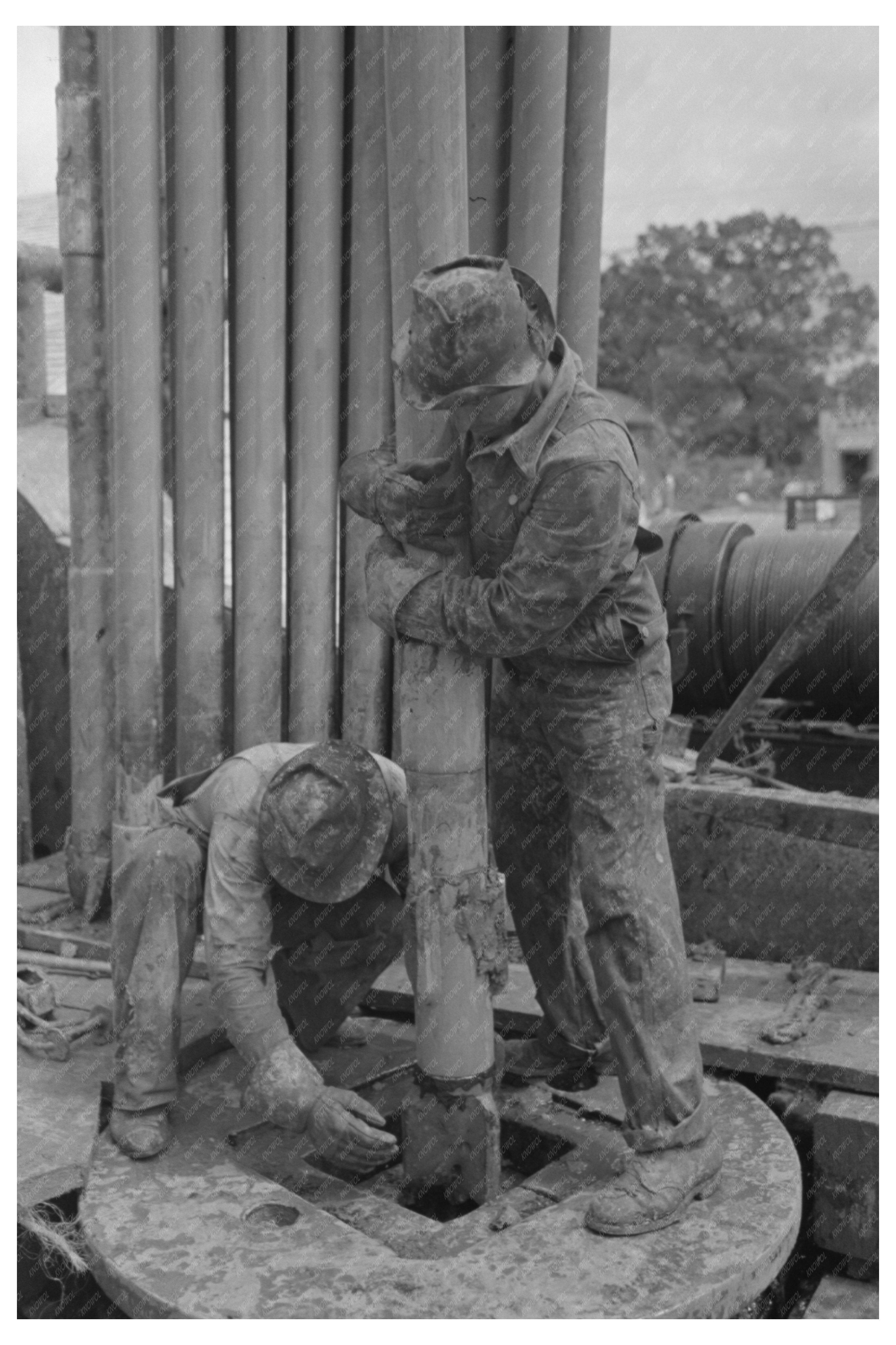 Guiding Bit in Rotary Table at Kilgore Oil Well 1939
