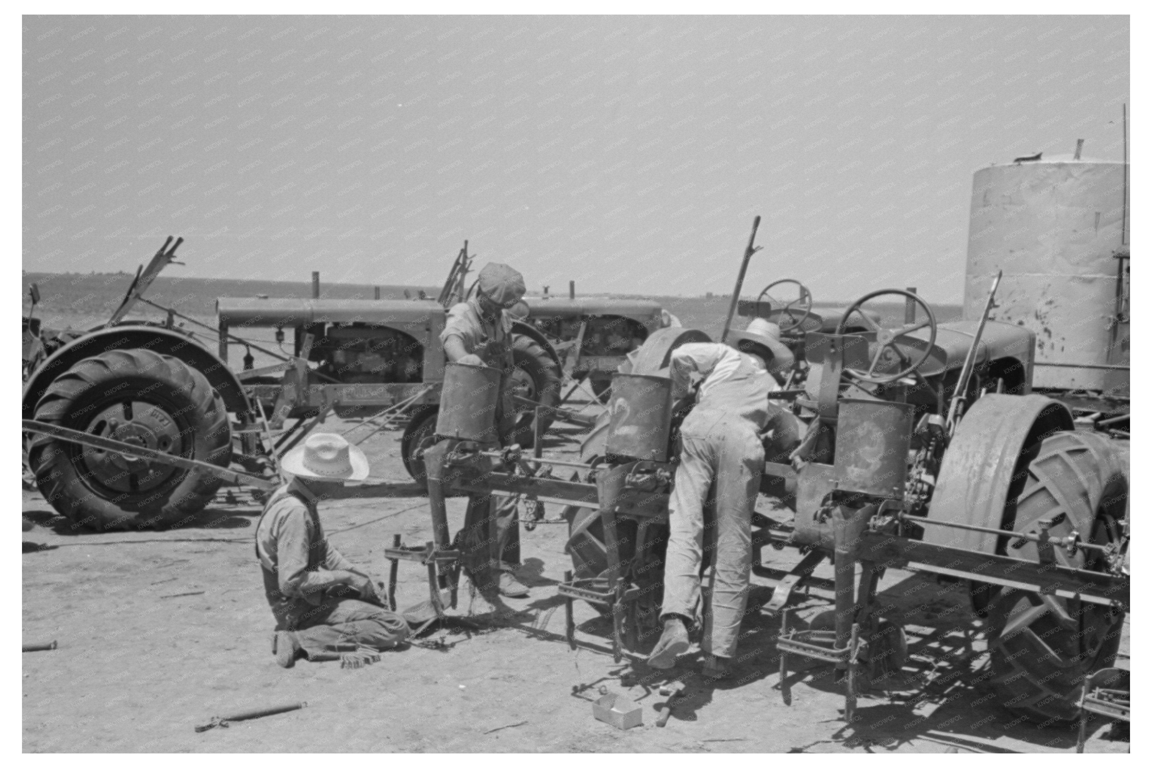 Day Laborer Changing Plow Points on Farm Tractor May 1939