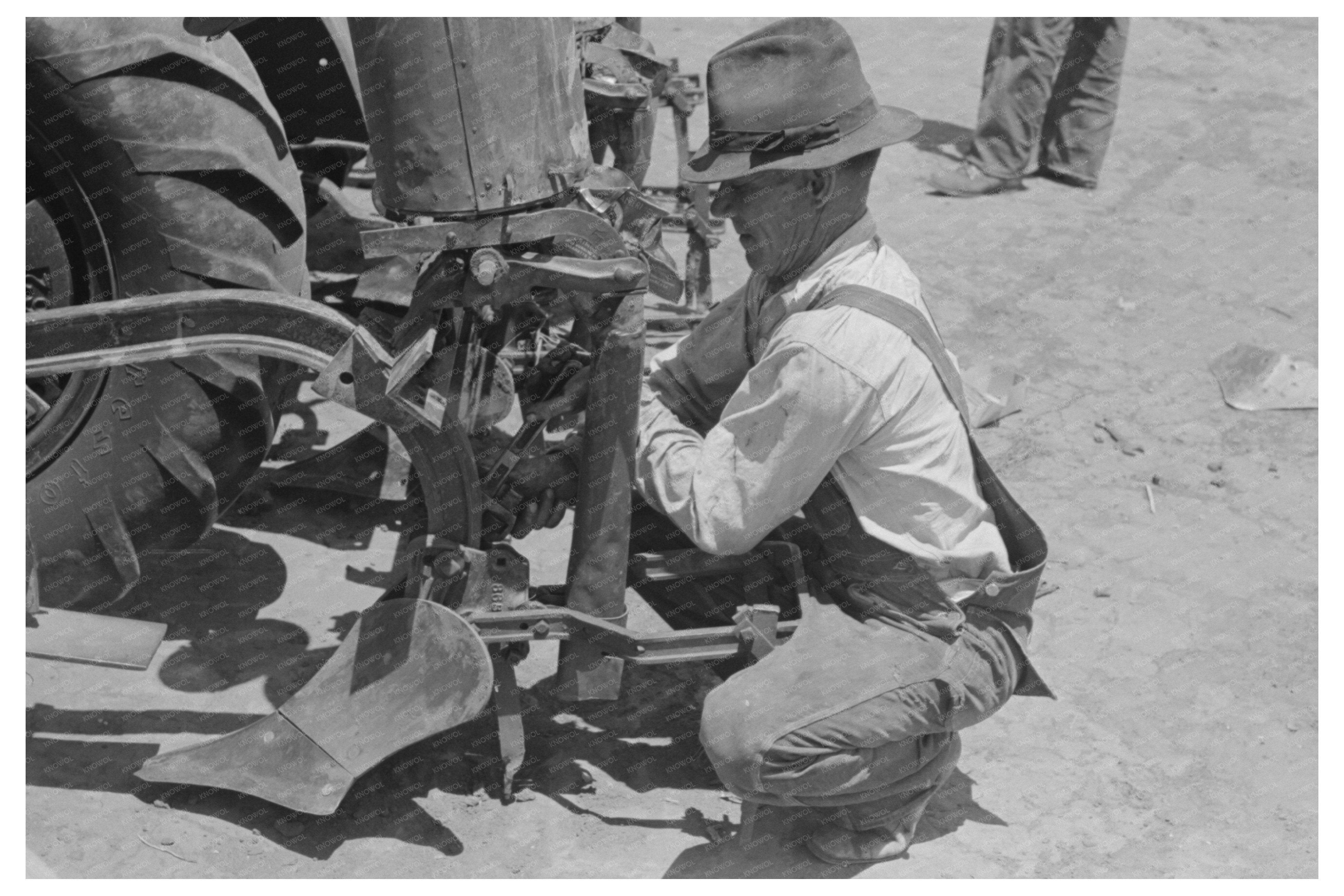 Day Laborer Changing Plow Points on Farm May 1939