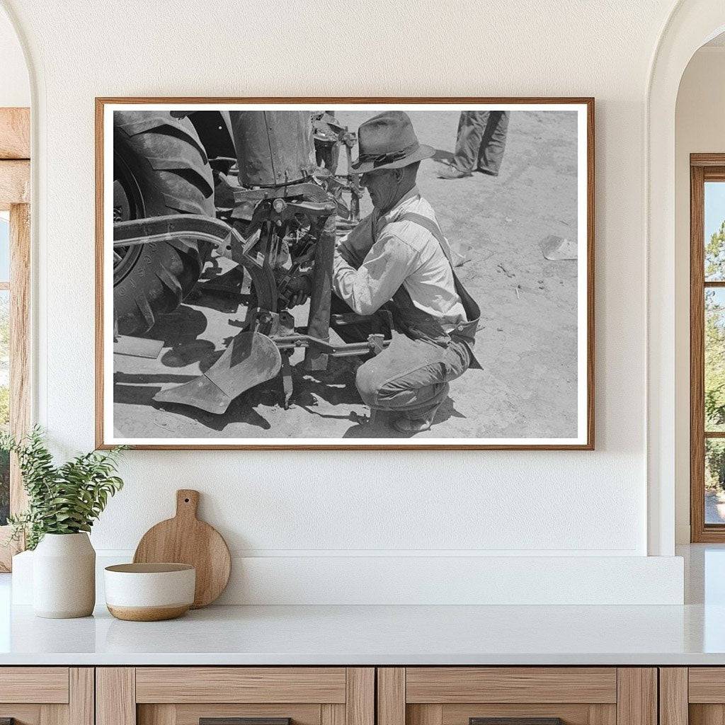 Day Laborer Changing Plow Points on Farm May 1939