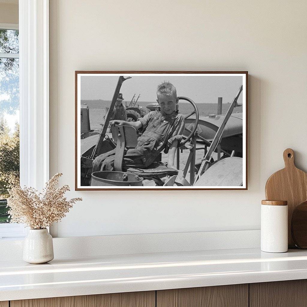 Son of Day Laborer on Tractor in Ralls Texas 1939