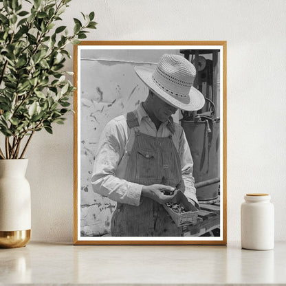 Farm Laborer Examines Nuts and Bolts Ralls Texas 1939