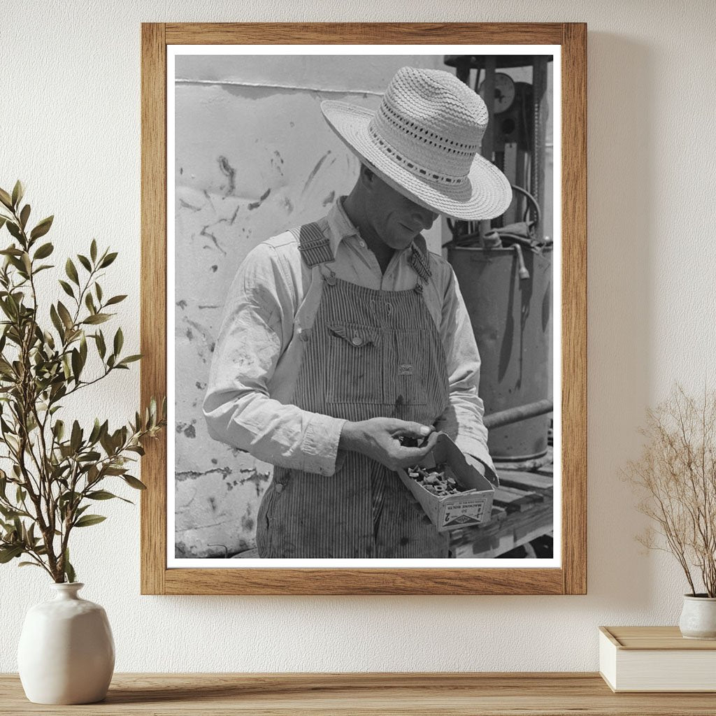 Farm Laborer Examines Nuts and Bolts Ralls Texas 1939