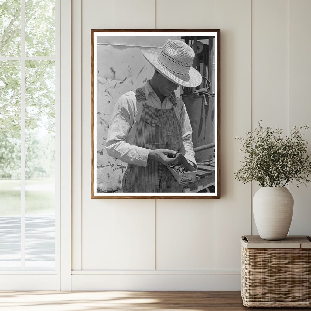 Farm Laborer Examines Nuts and Bolts Ralls Texas 1939