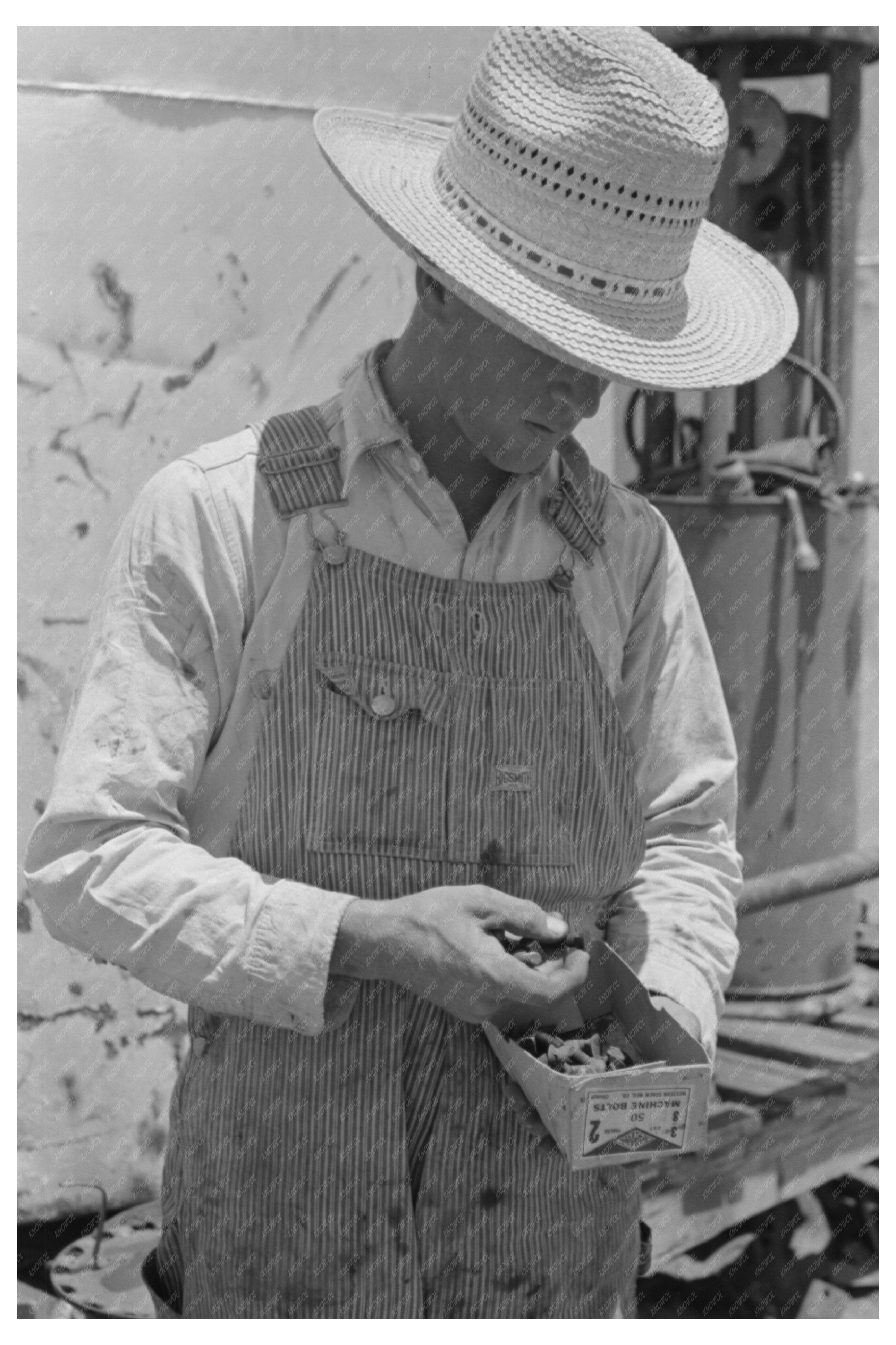 Day Laborer Examining Nuts and Bolts on Texas Farm 1939