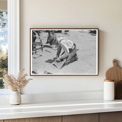 Day Laborer Adjusts Plow Points on Tractor May 1939