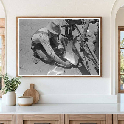 Day Laborer Adjusts Plow Points on Texas Farm May 1939