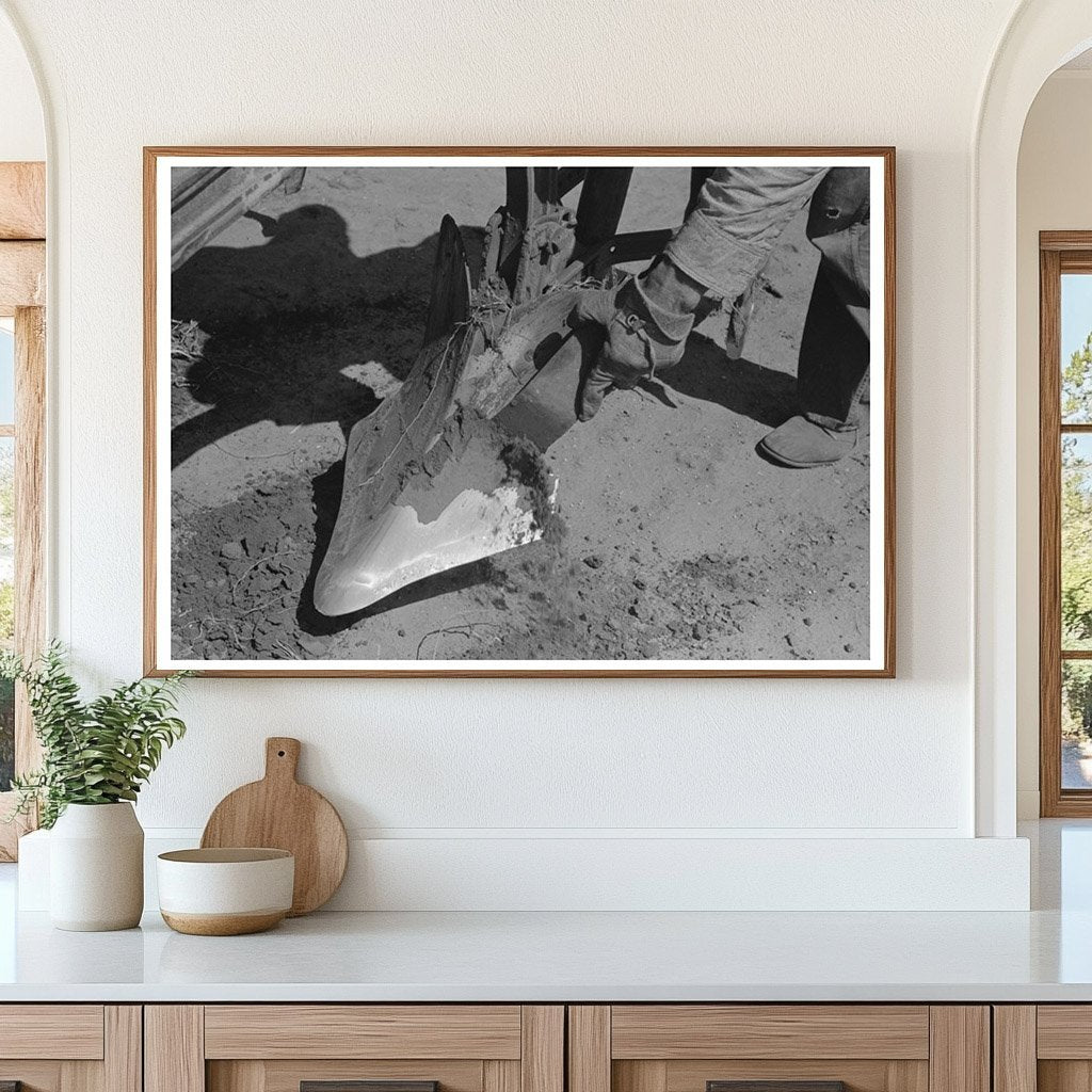 Farmer Cleaning Plow Point on Texas Farm May 1939