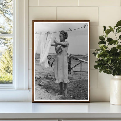 Daughter of Tenant Farmer Hangs Clothes Warner Oklahoma 1939