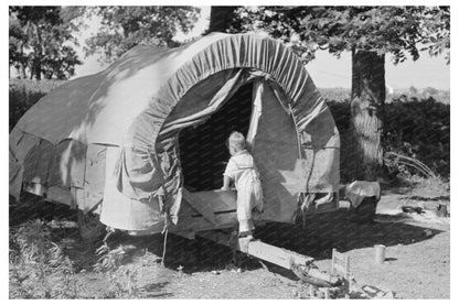 Child of Migrant Entering Covered Wagon Oklahoma 1939