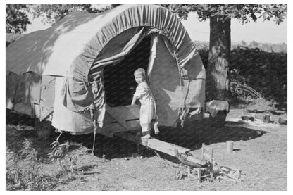 Child of Migrant Family in Covered Wagon 1939