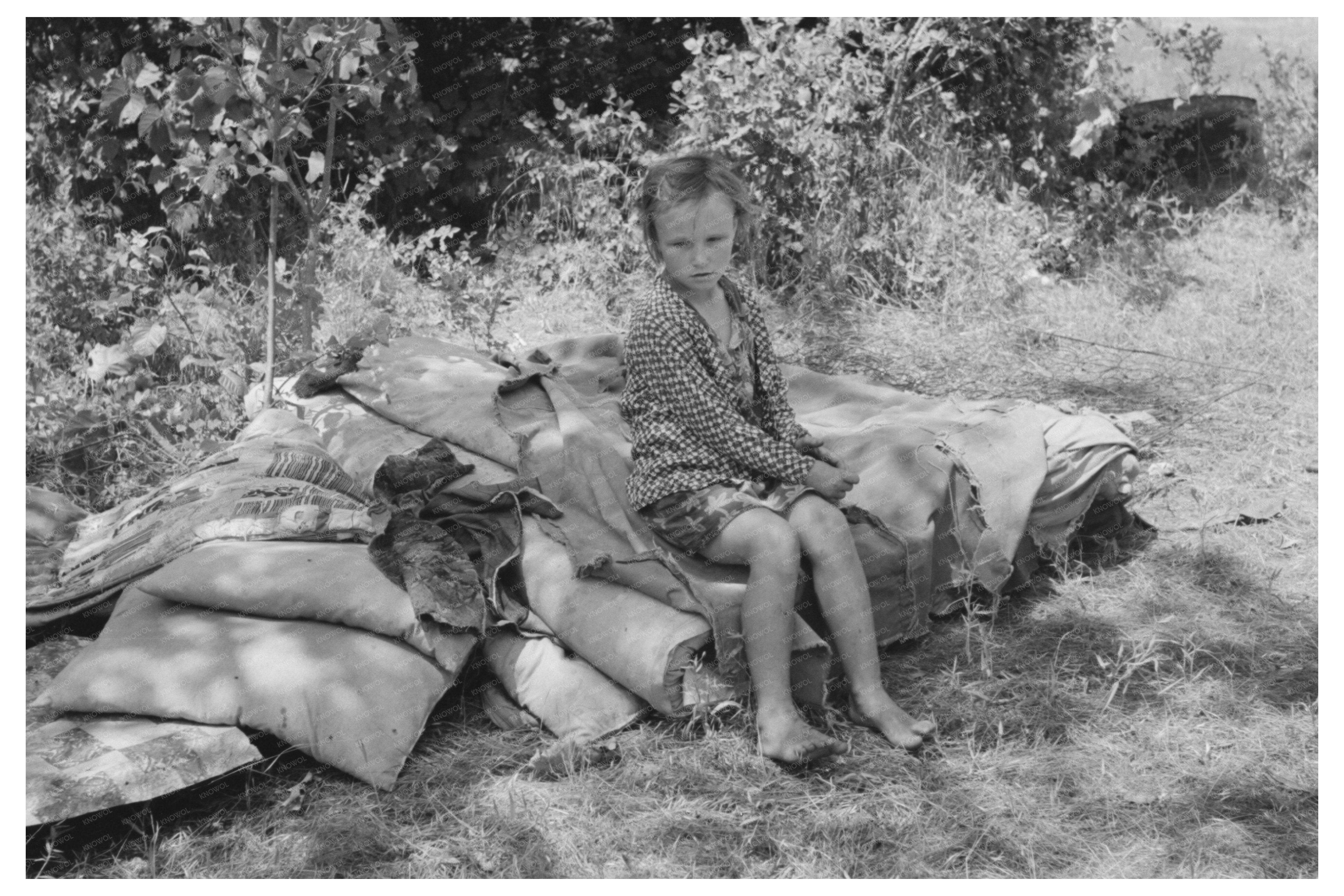 Migrant Child on Roadside Bedclothing Sequoyah County 1939