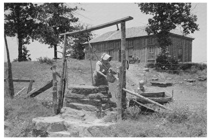 Tenant Farmer Drawing Water in Sallisaw Oklahoma 1939