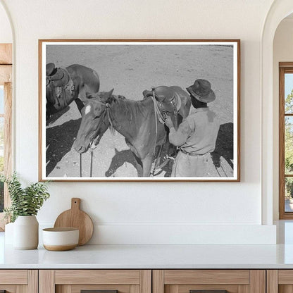 Cowboy Saddling Horse at Walking X Ranch May 1939