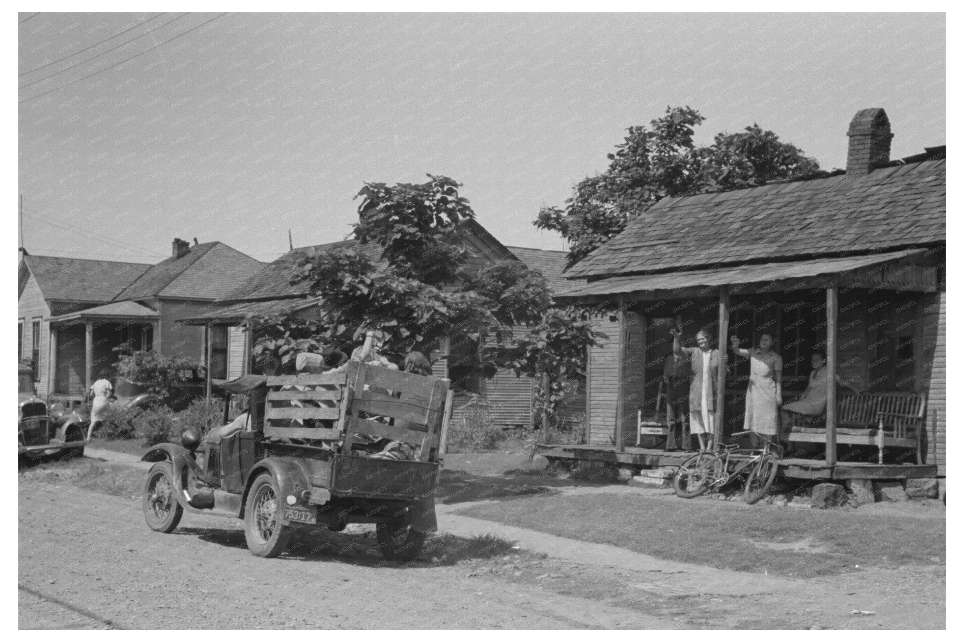 Migrant Family Resting in Truck Oklahoma July 1939