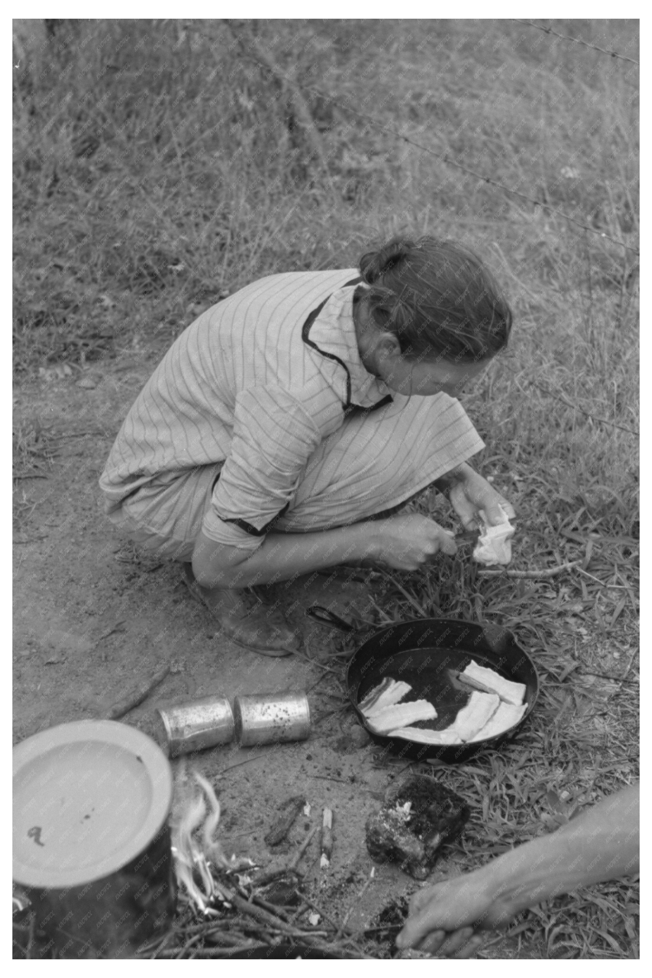 Migrant Family Cooking in Henrietta Oklahoma July 1939