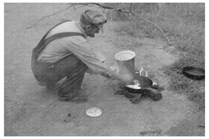 Elmer Thomas Cooking at Migrant Camp Oklahoma July 1939