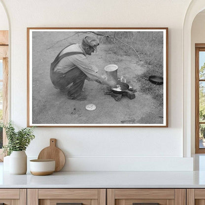 Elmer Thomas Cooking at Migrant Camp Oklahoma July 1939