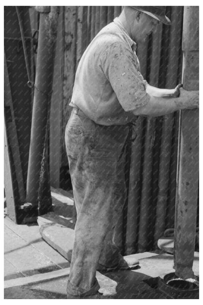 Roughneck Guiding Bailer in Oil Well Oklahoma August 1939