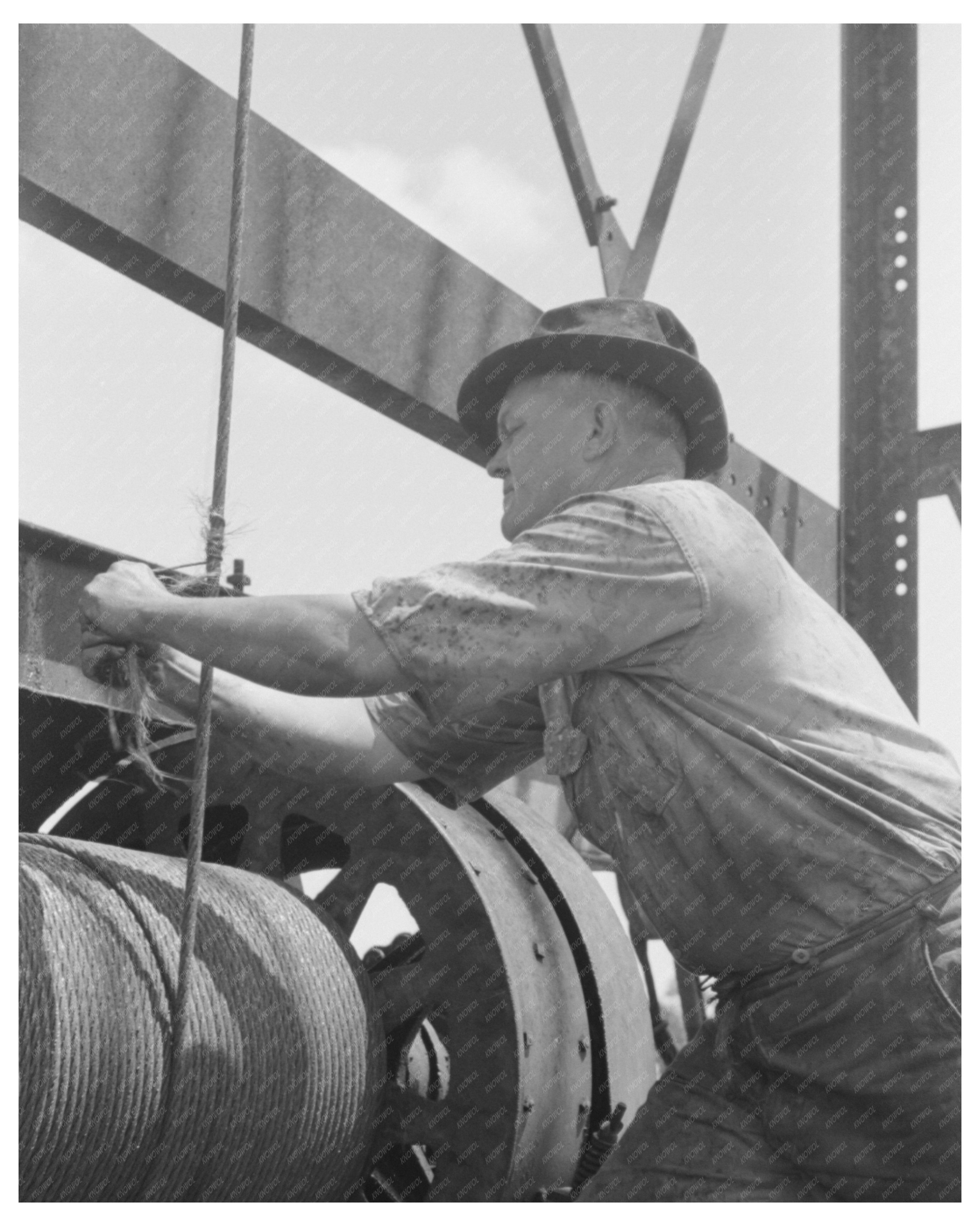 Roughneck Securing Cable at Oil Well August 1939