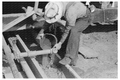 Oil Field Worker Examines Drilling Mud August 1939