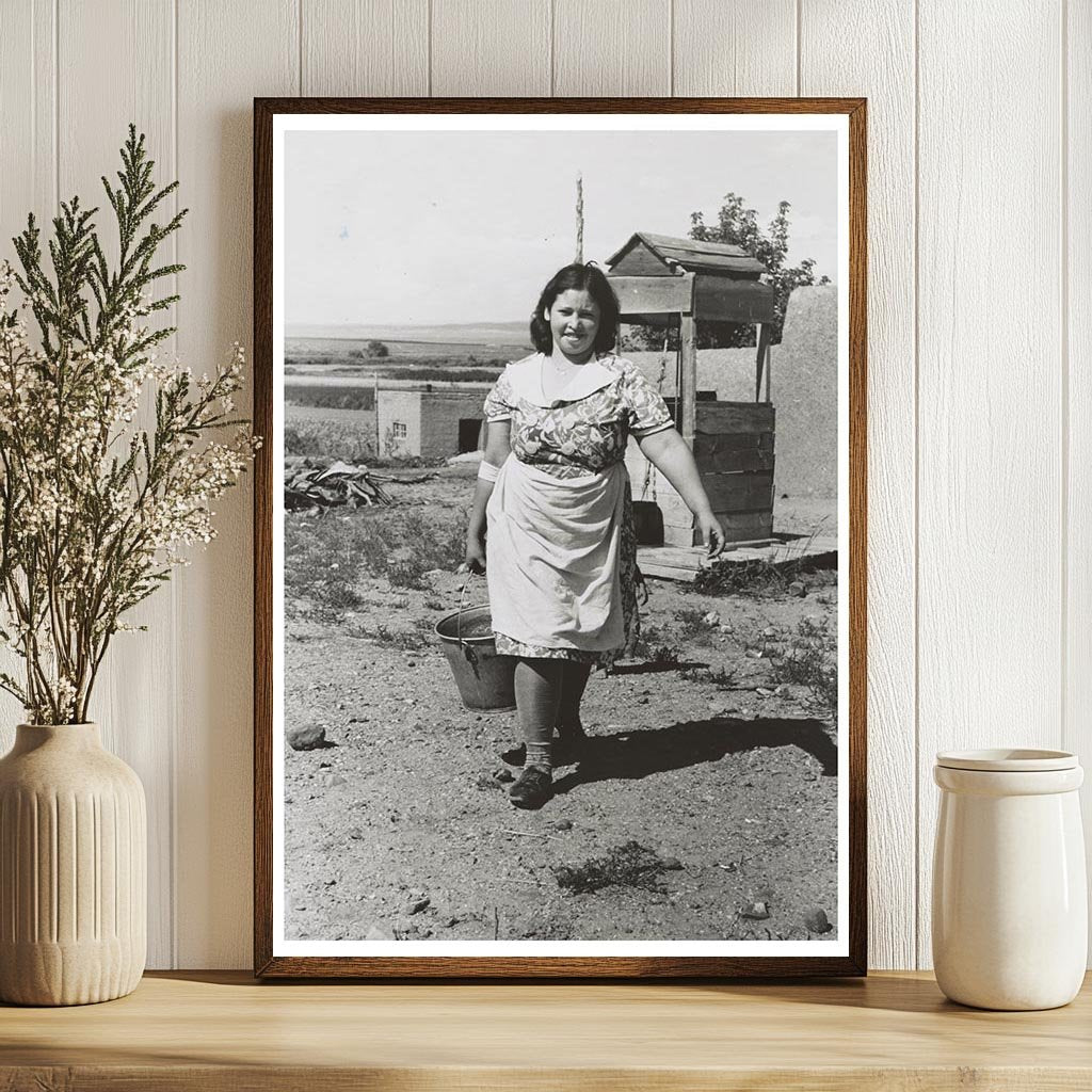 Child Carries Water from Well in Taos County 1939