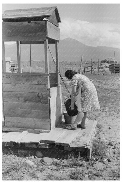 Daughter Drawing Water at Well Taos County New Mexico 1939