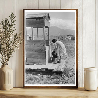 Daughter Drawing Water at Well Taos County New Mexico 1939