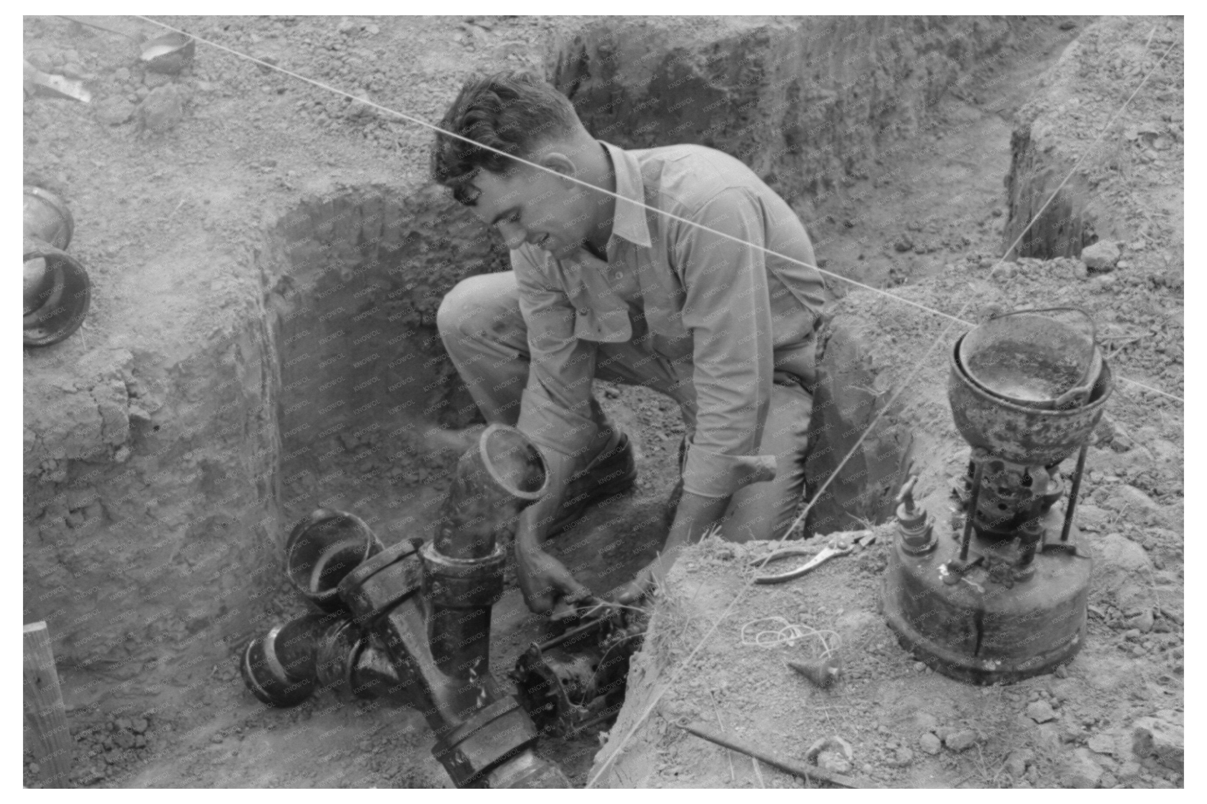 Soldering Cast Iron Sewer Pipe at Texas Migrant Camp 1939