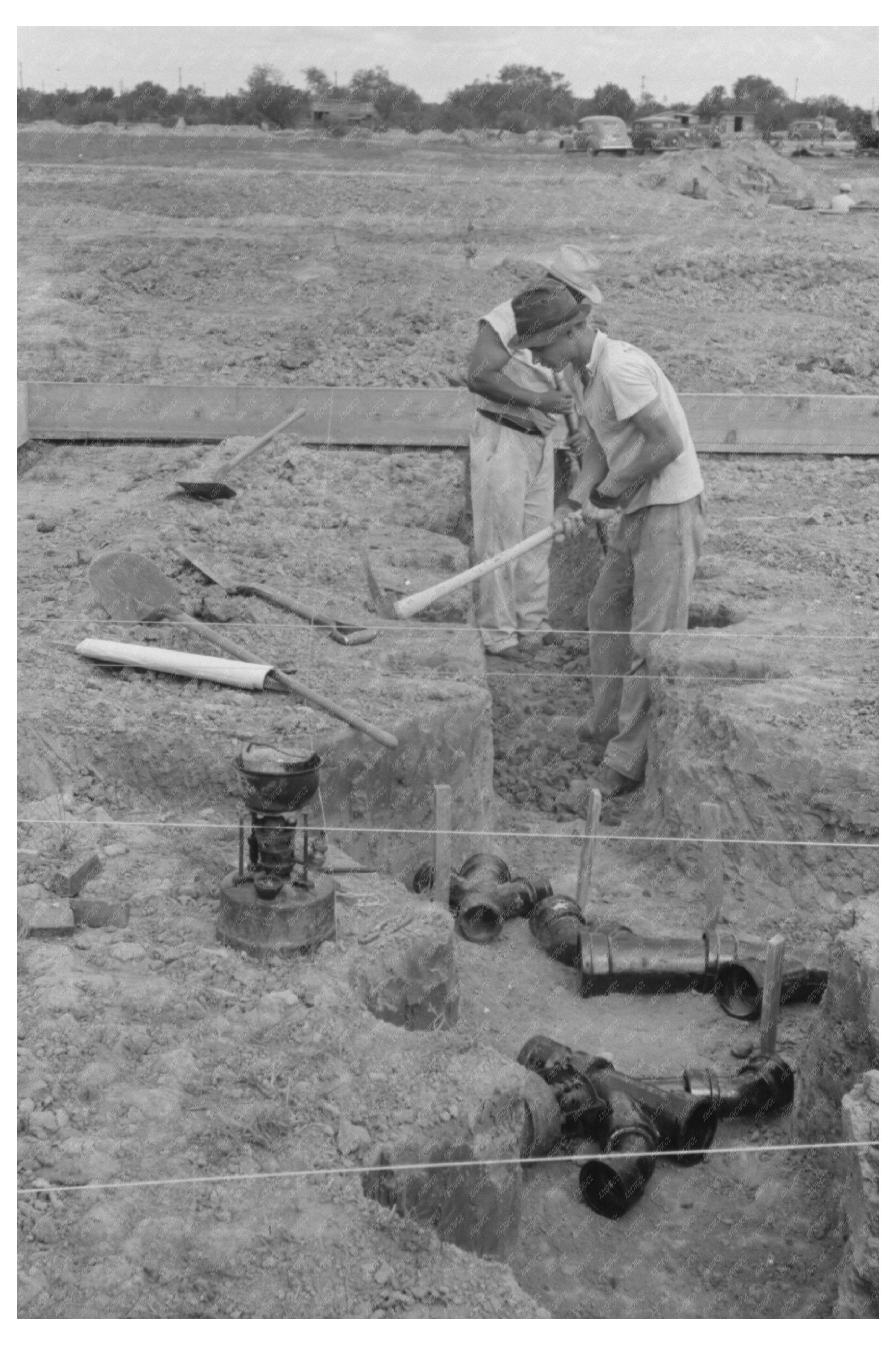 Soldering Cast Iron Pipe at Texas Migrant Camp 1939