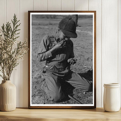 African American Boy Eating Black Walnuts February 1944