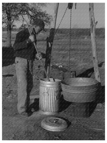 Young Boy Feeding Hogs in Creek County Oklahoma 1944