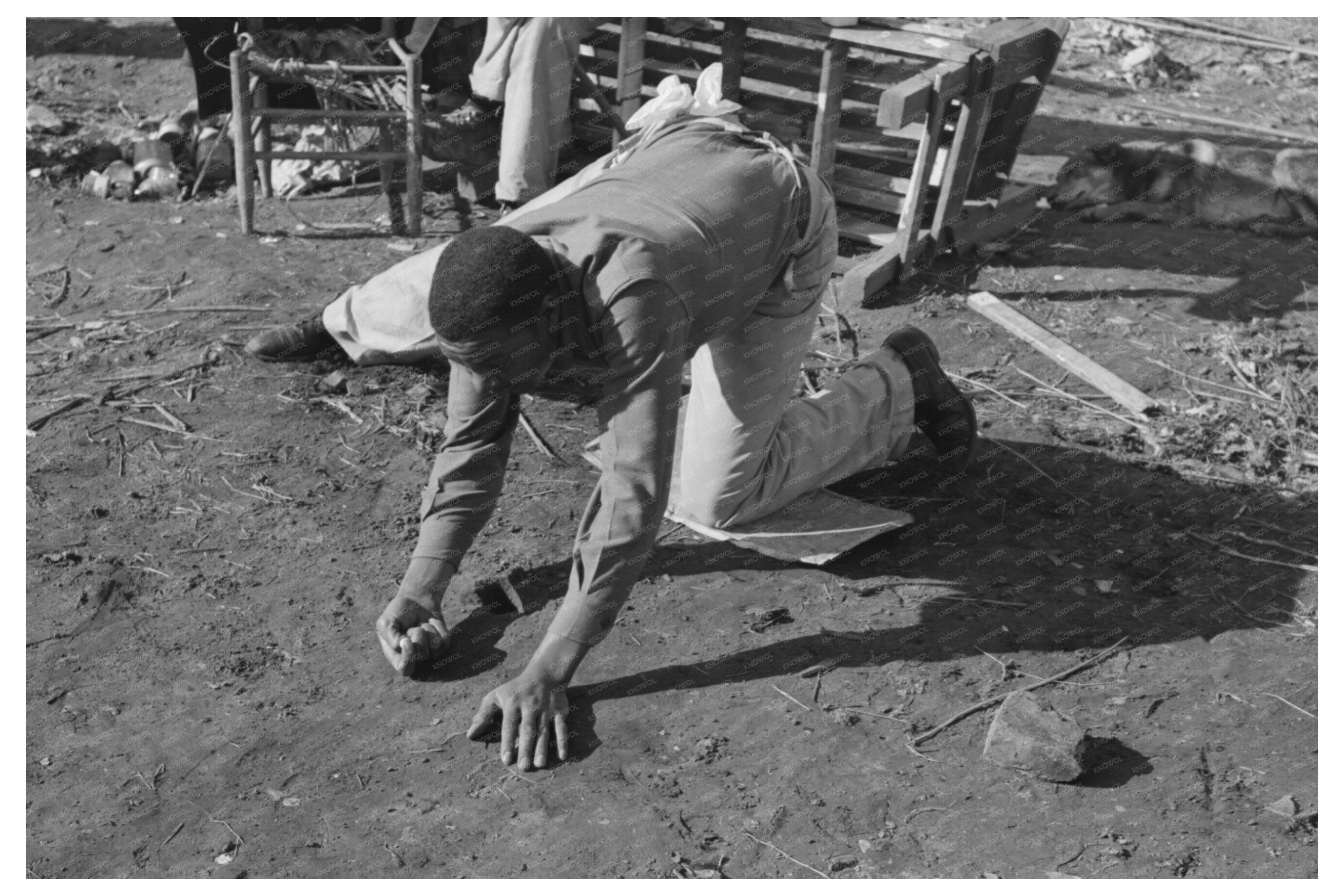 Child Playing Marbles in Eufaula Oklahoma 1940