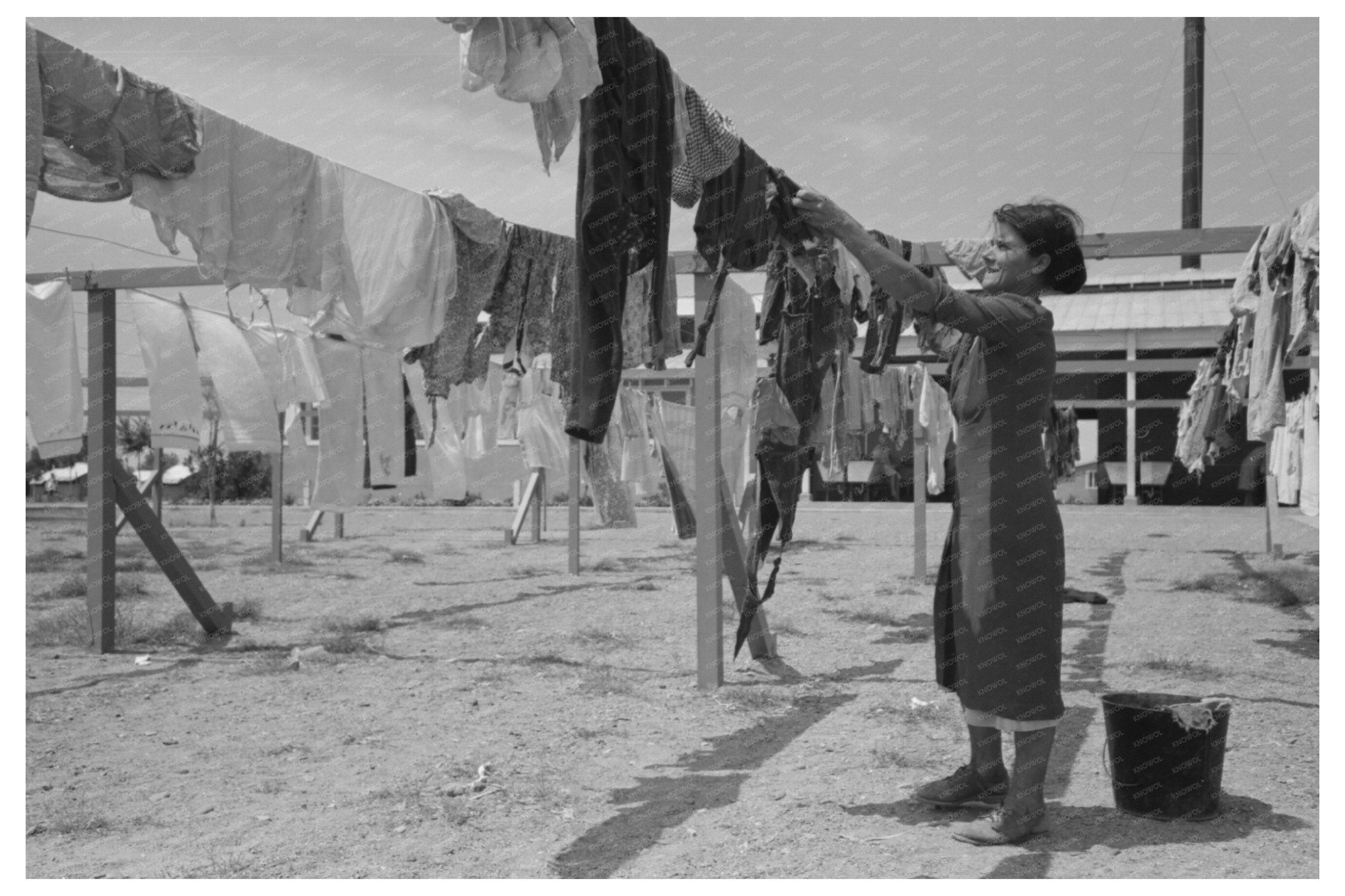 Woman Hanging Laundry at Agua Fria Labor Camp May 1940