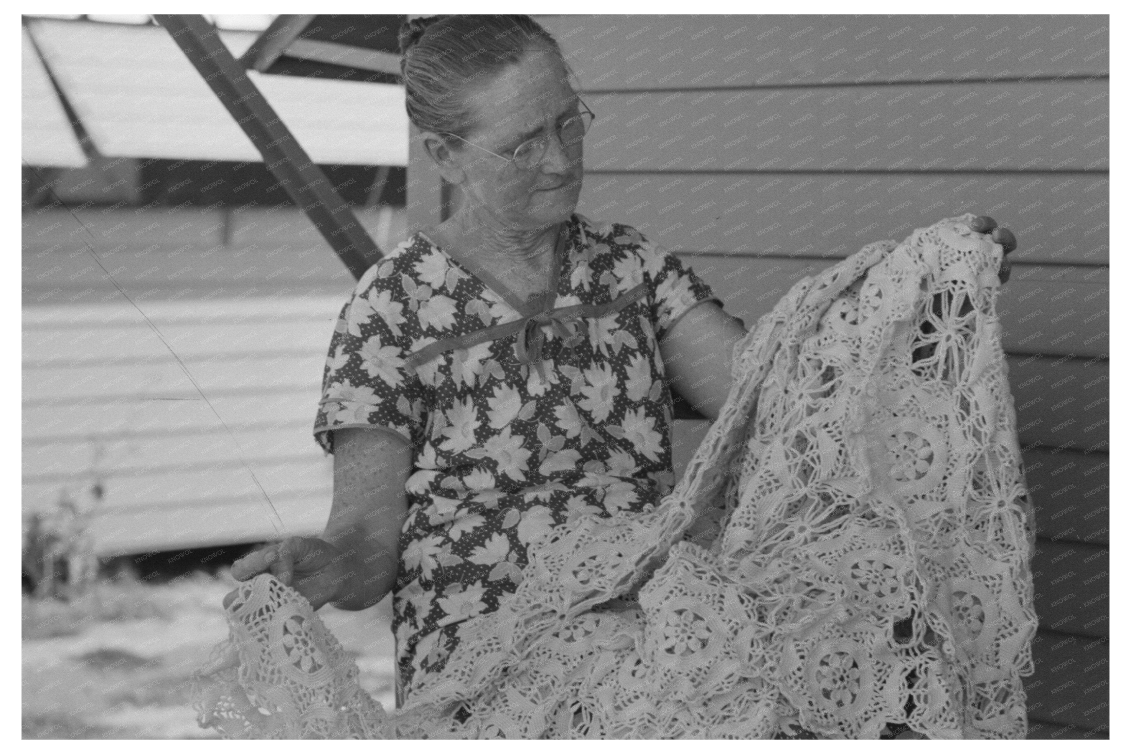 Woman Examining Crocheted Bedspread Agua Fria Camp 1940