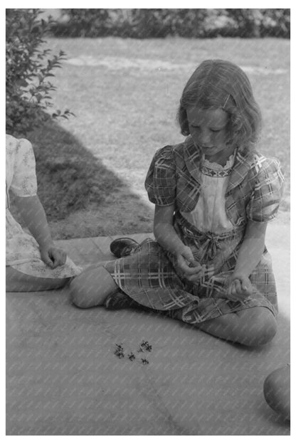 Young Girl Playing Jacks at Casa Grande Farms 1940