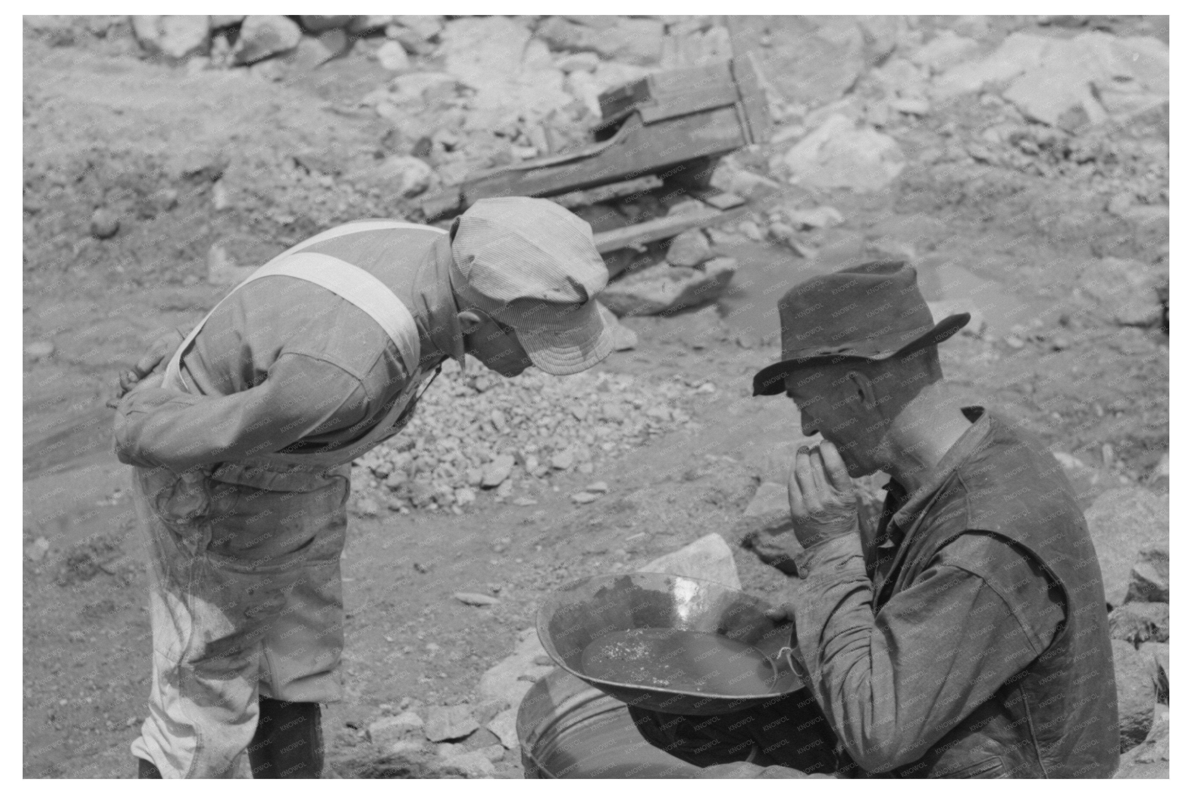 Miner Examines Pan with Prospector in Pinos Altos 1940