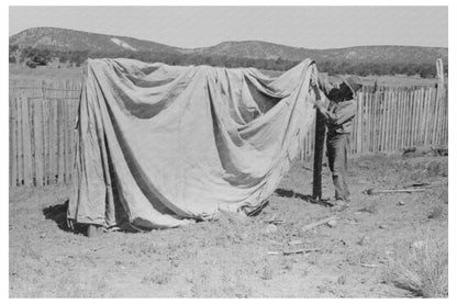 Faro Caudill erects tent in Pie Town New Mexico 1940